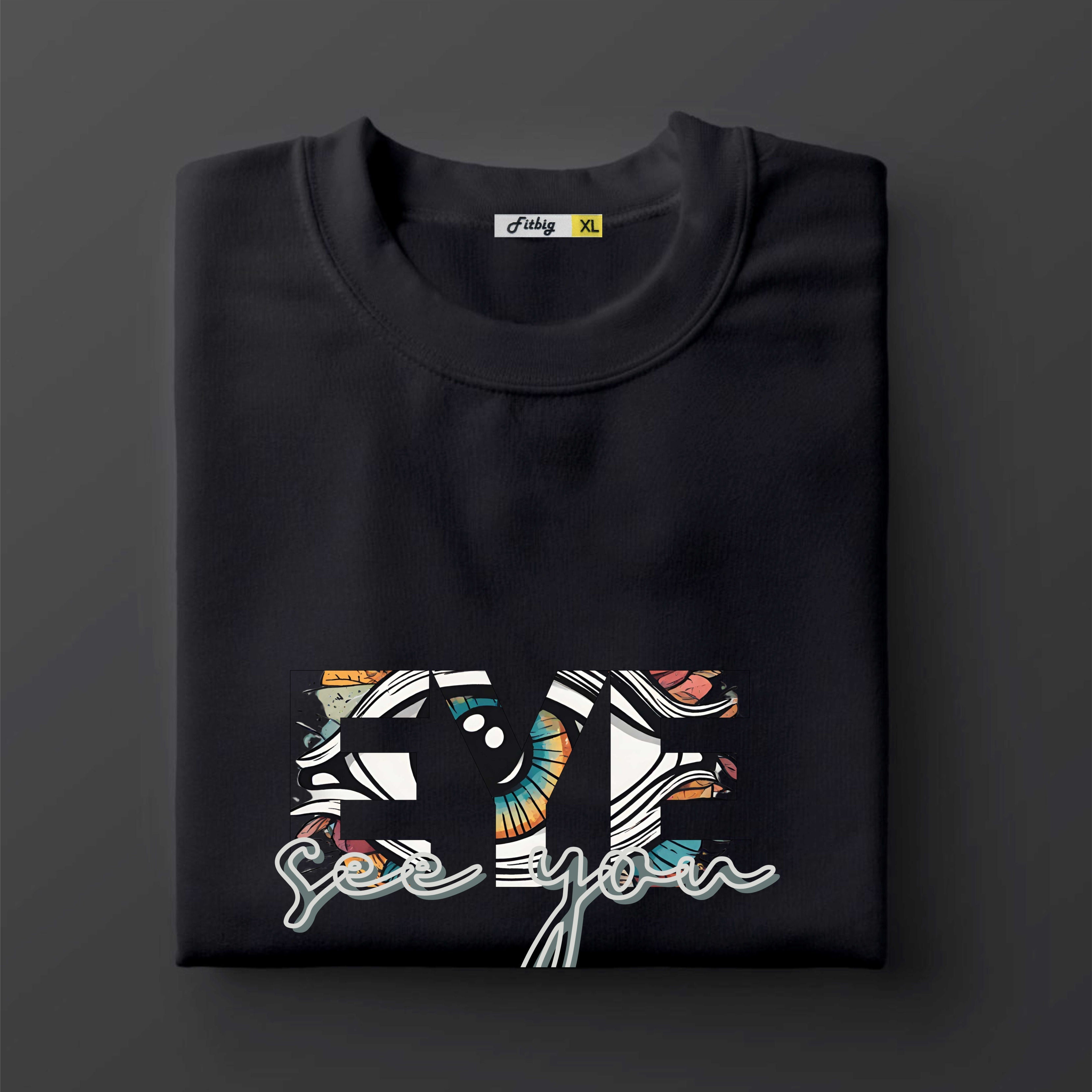 Black t shirt with colorful graphic design on a dark background