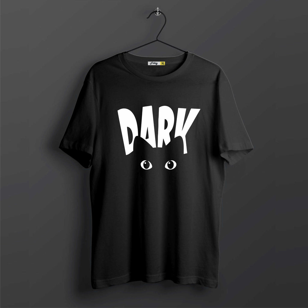 Black t-shirt with 'DARK' printed on it against a dark background