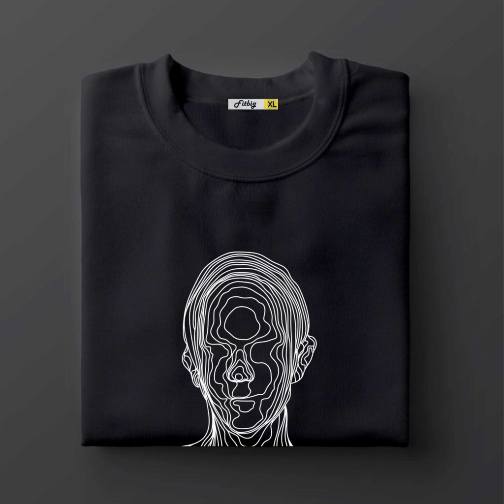 Black t shirt with a white line art design of a face on a dark background