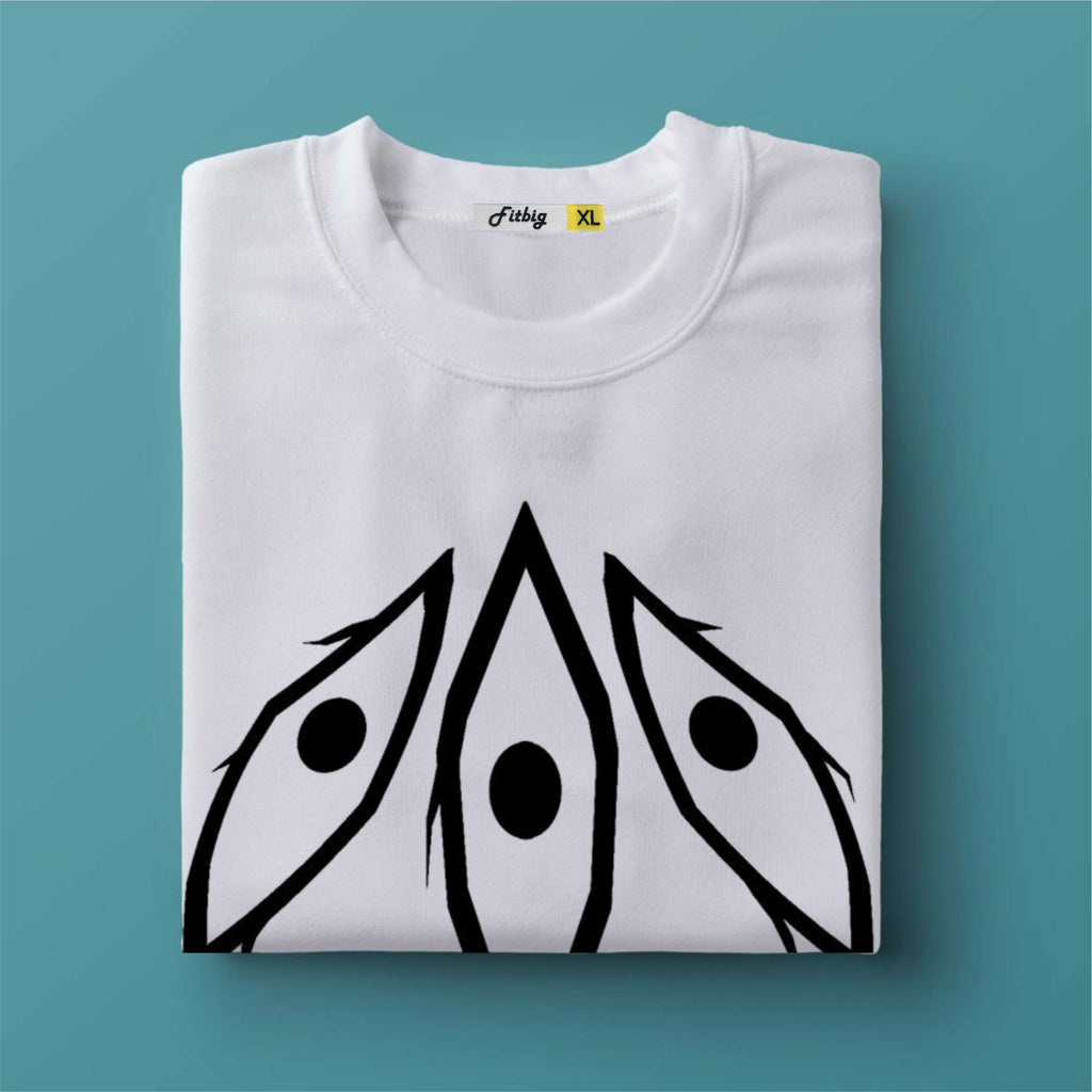 Folded white t-shirt with black abstract design on a teal background