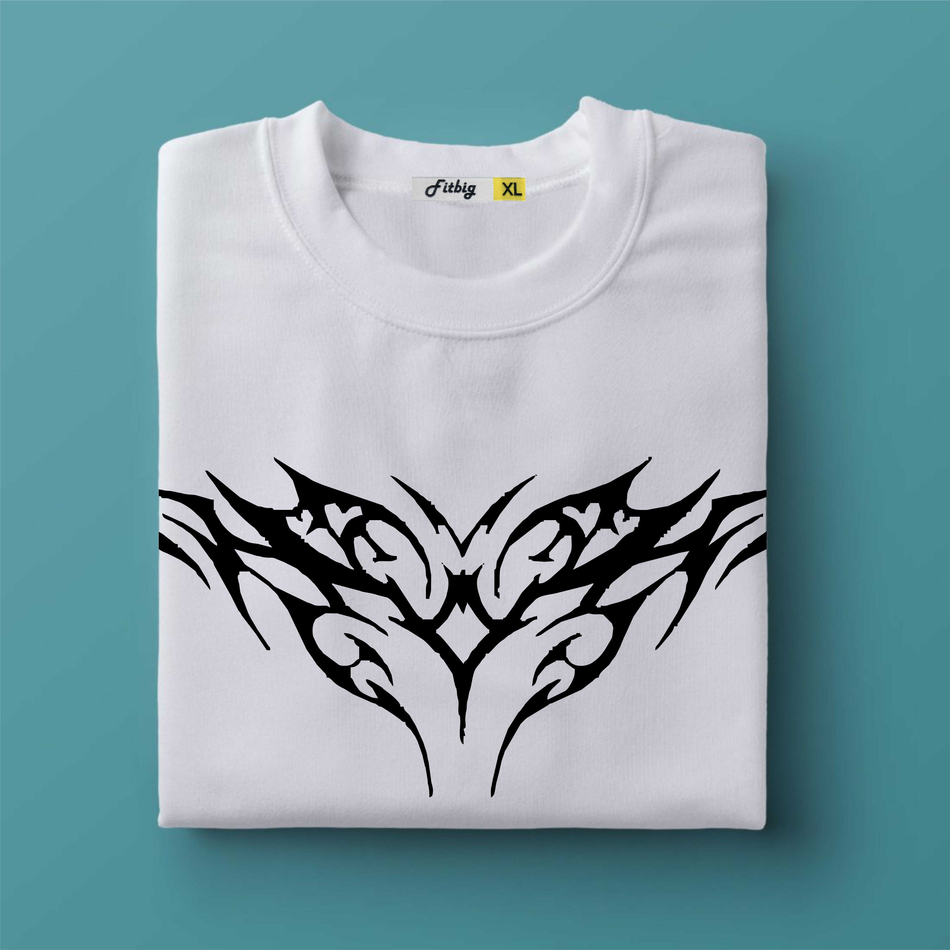 Folded white t-shirt with black tribal design on a teal background