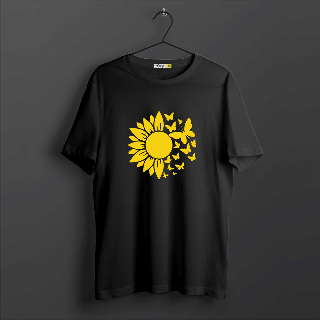 Black t-shirt with a yellow sunflower design on a dark background