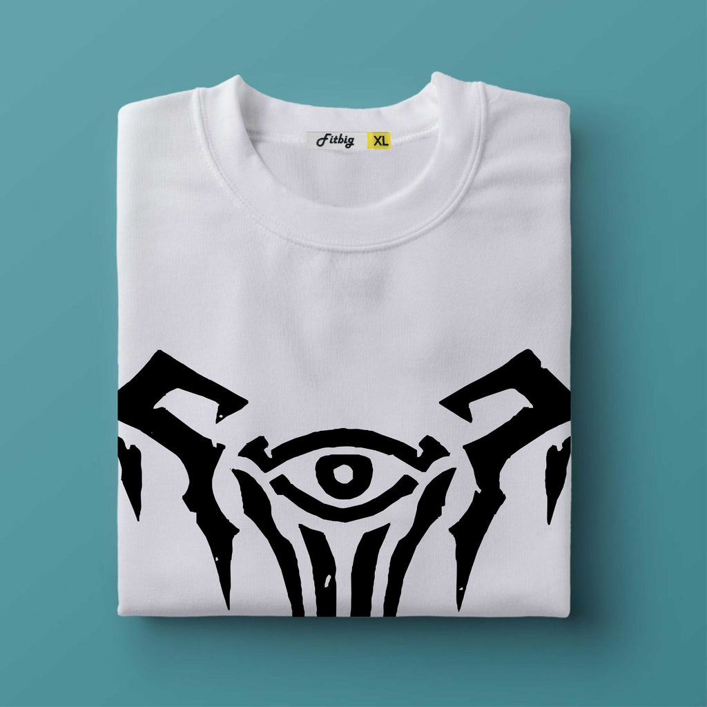 Folded white t-shirt with black tribal design on a teal background