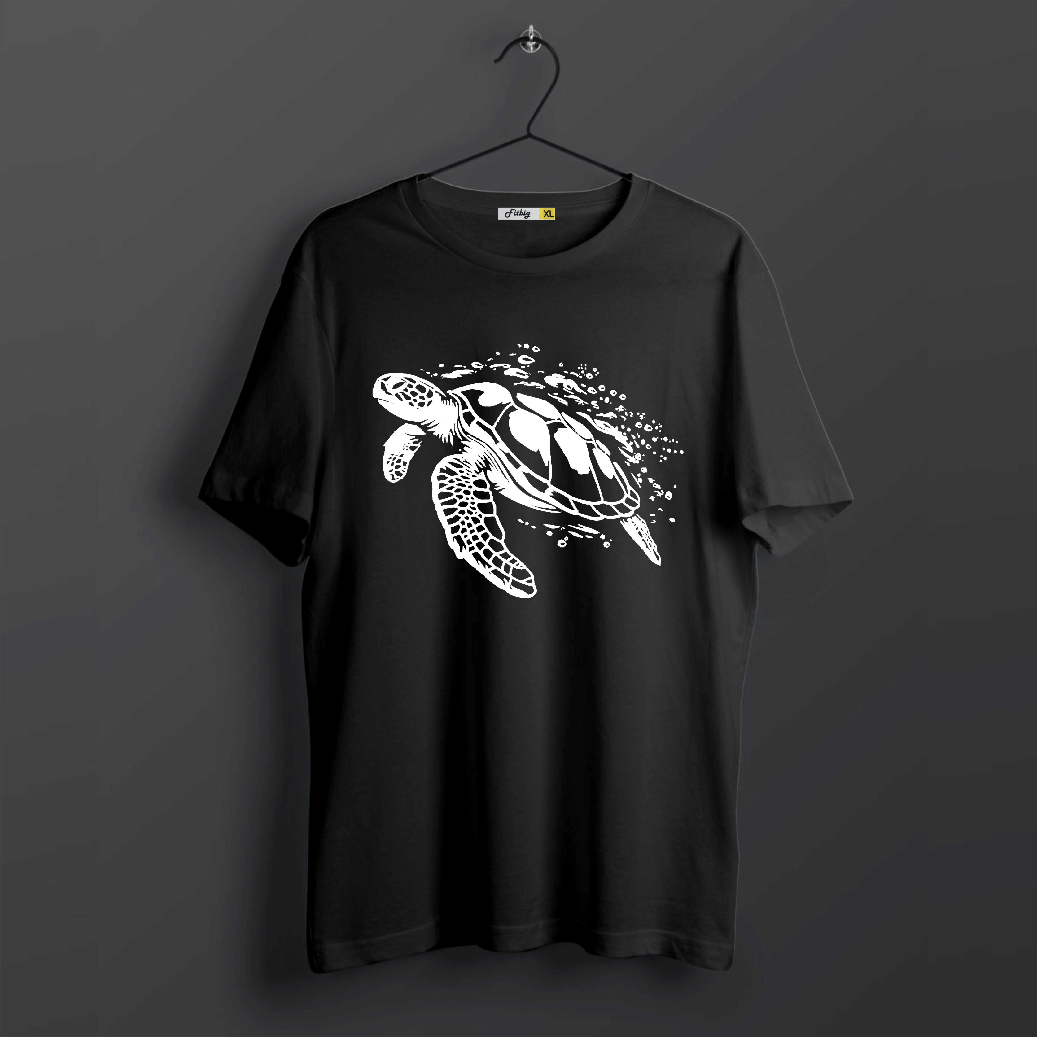 Black t-shirt with a white turtle design on a dark background
