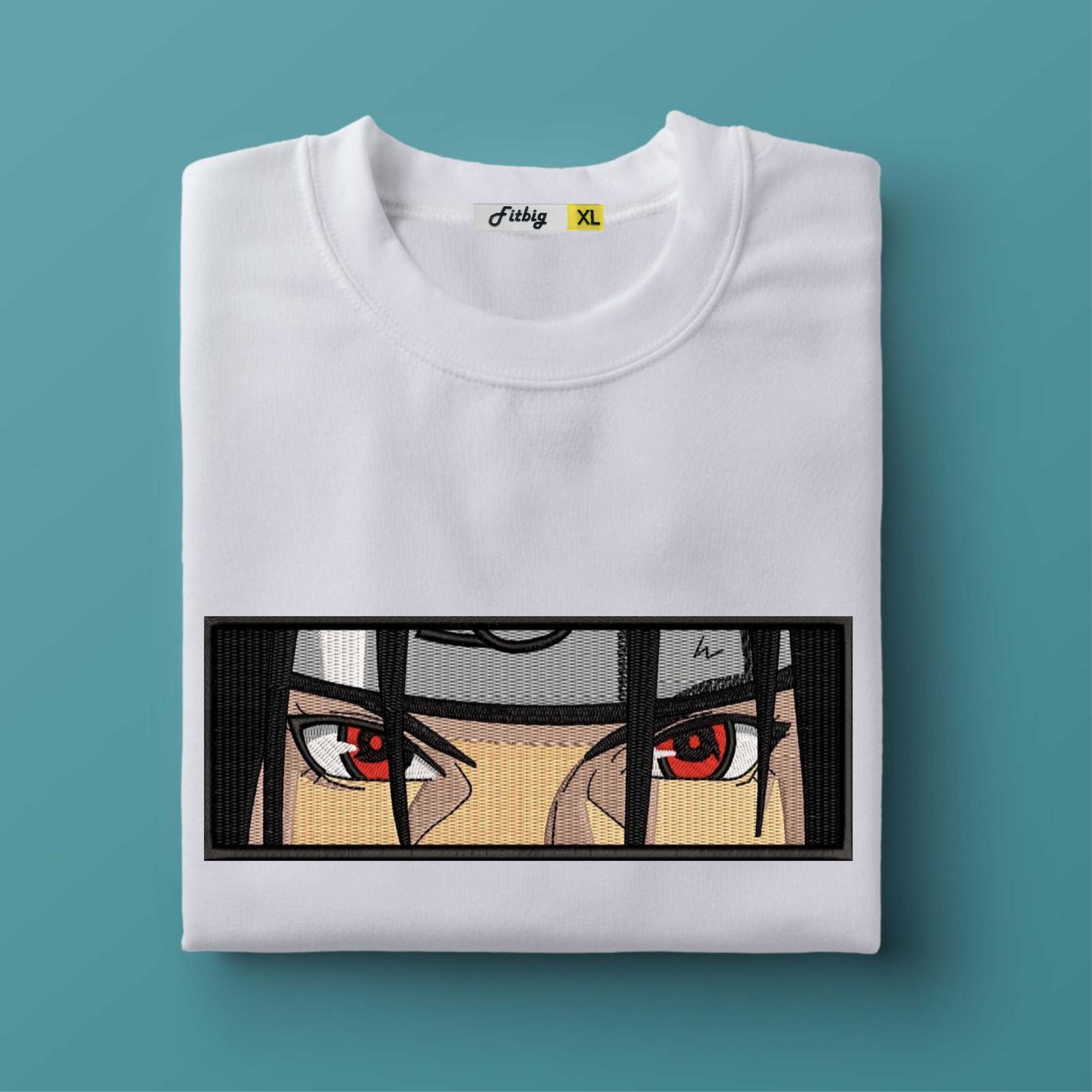 White t-shirt with anime-style eye design on a teal background