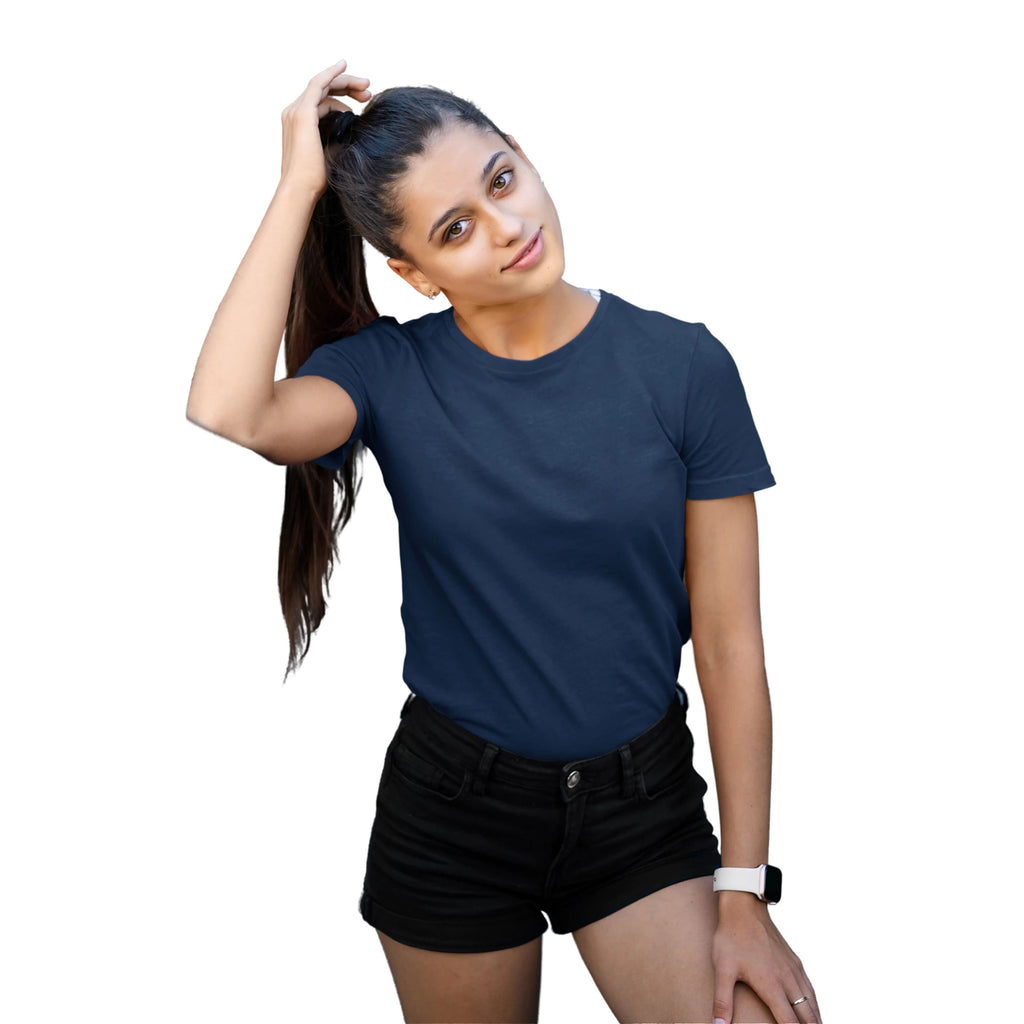 Woman wearing a navy blue t-shirt and black shorts on a white background