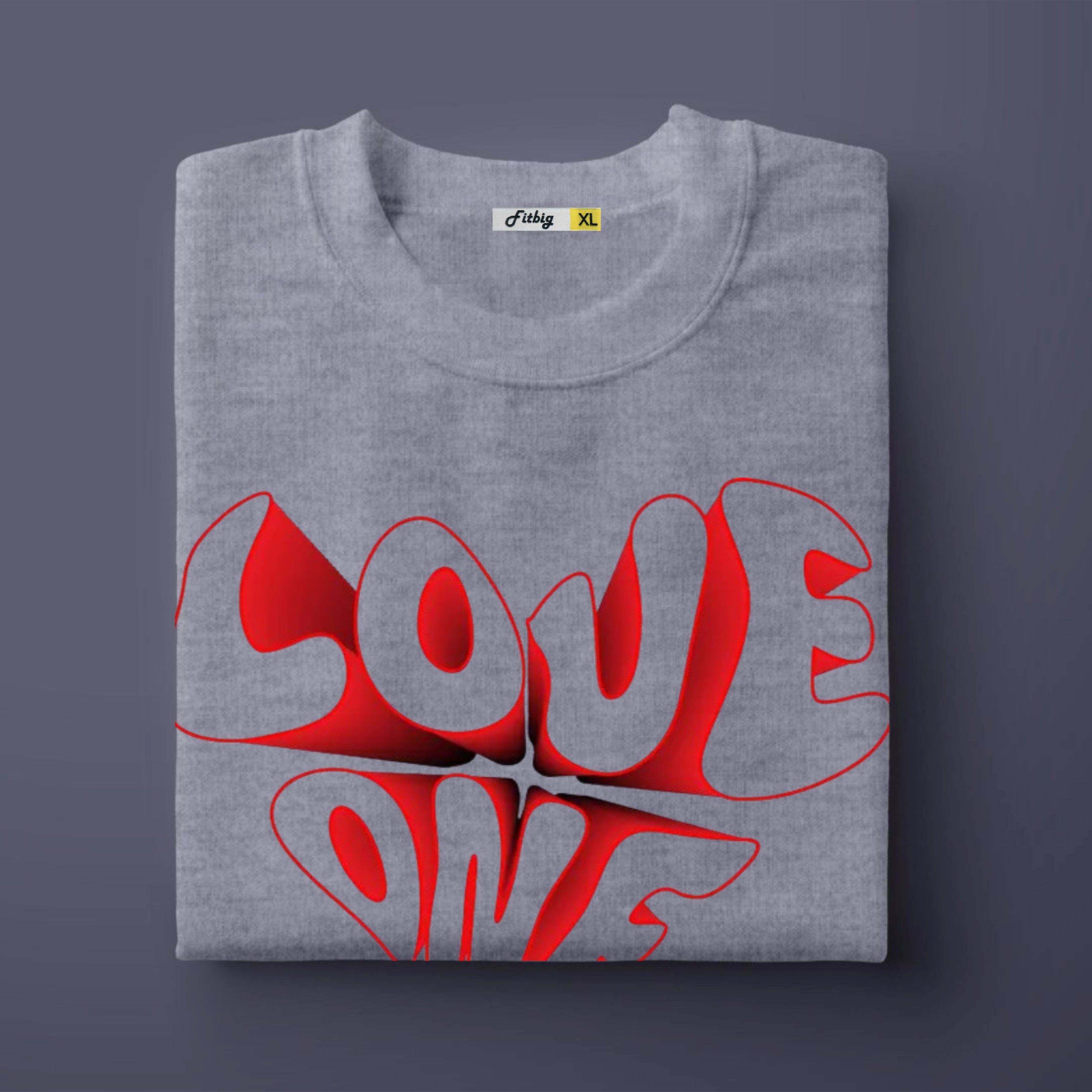 Folded gray t-shirt with red 'LOVE ONE' design on a dark background