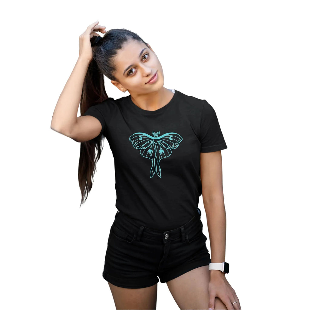Woman wearing a black t-shirt with a green butterfly design on a white background